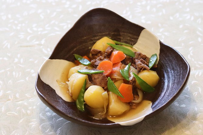 Authentic Seasonal Japanese Home Cooking Lesson With a Charming Local in Kyoto - Immersing Yourself in the Warmth and Charm of Kyotos Hospitality